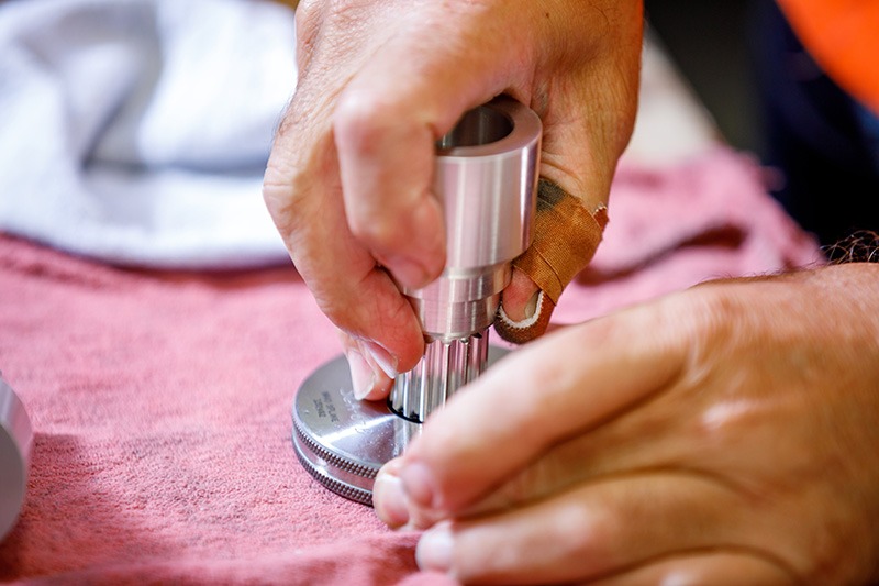 person fitting two parts together