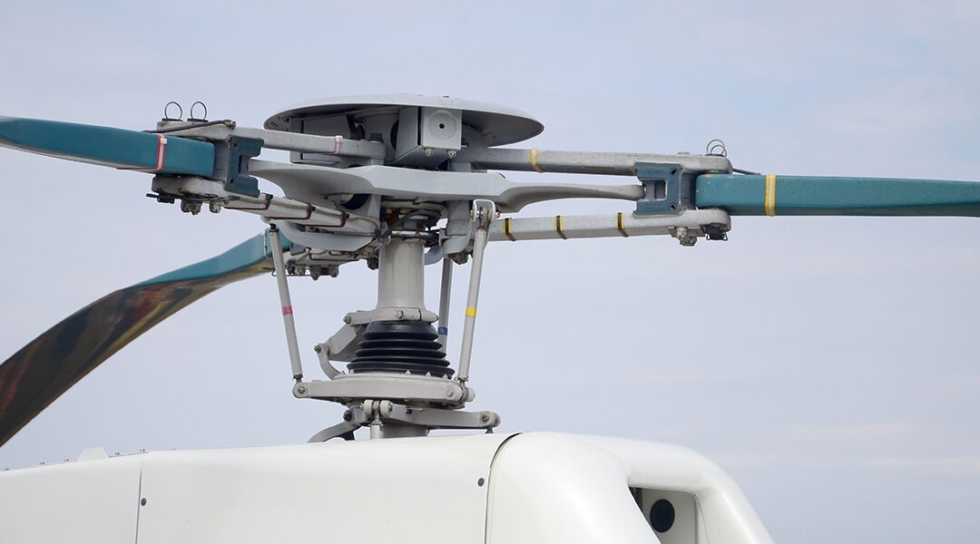 helicopter screw engine close up against blue sky